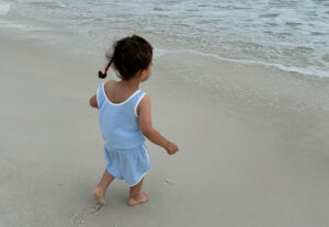 3 year old daughter on the beach